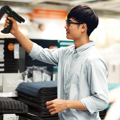 Retail staff scanning in store